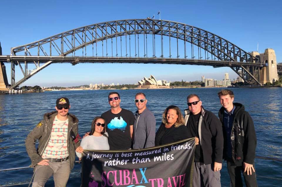 A group of dive friends with the Sydney Harbour Bridge in the background.